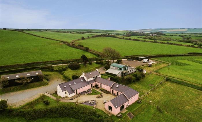 Aerial shot of accommodation surrounded by countryside